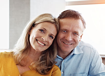 Photo of a man and woman smiling for a picture. Link to Life Stage Gift Planner Under Age 45 Situations.