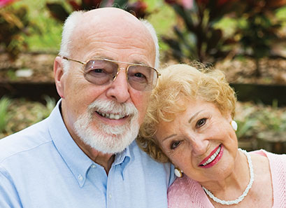 Photo of a man and woman smiling for a picture. Link to Life Stage Gift Planner Over Age 65 Situations.